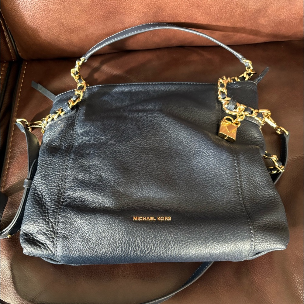 Michael Kors Navy Leather Shoulder Bag with Gold Accents. Style is Remy.